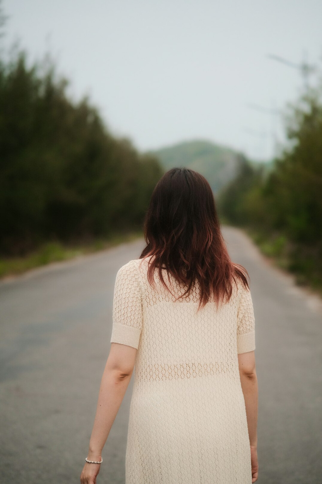 woman in white on road